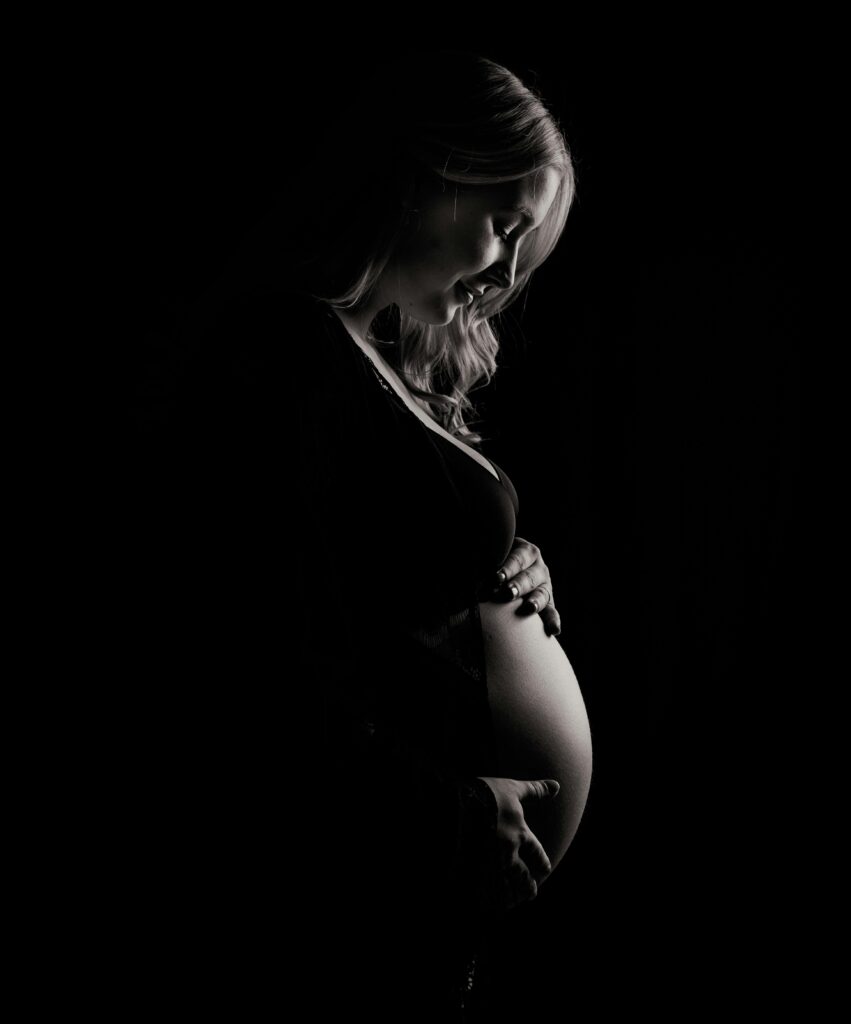 Striking monochrome image capturing the beauty and elegance of pregnancy.